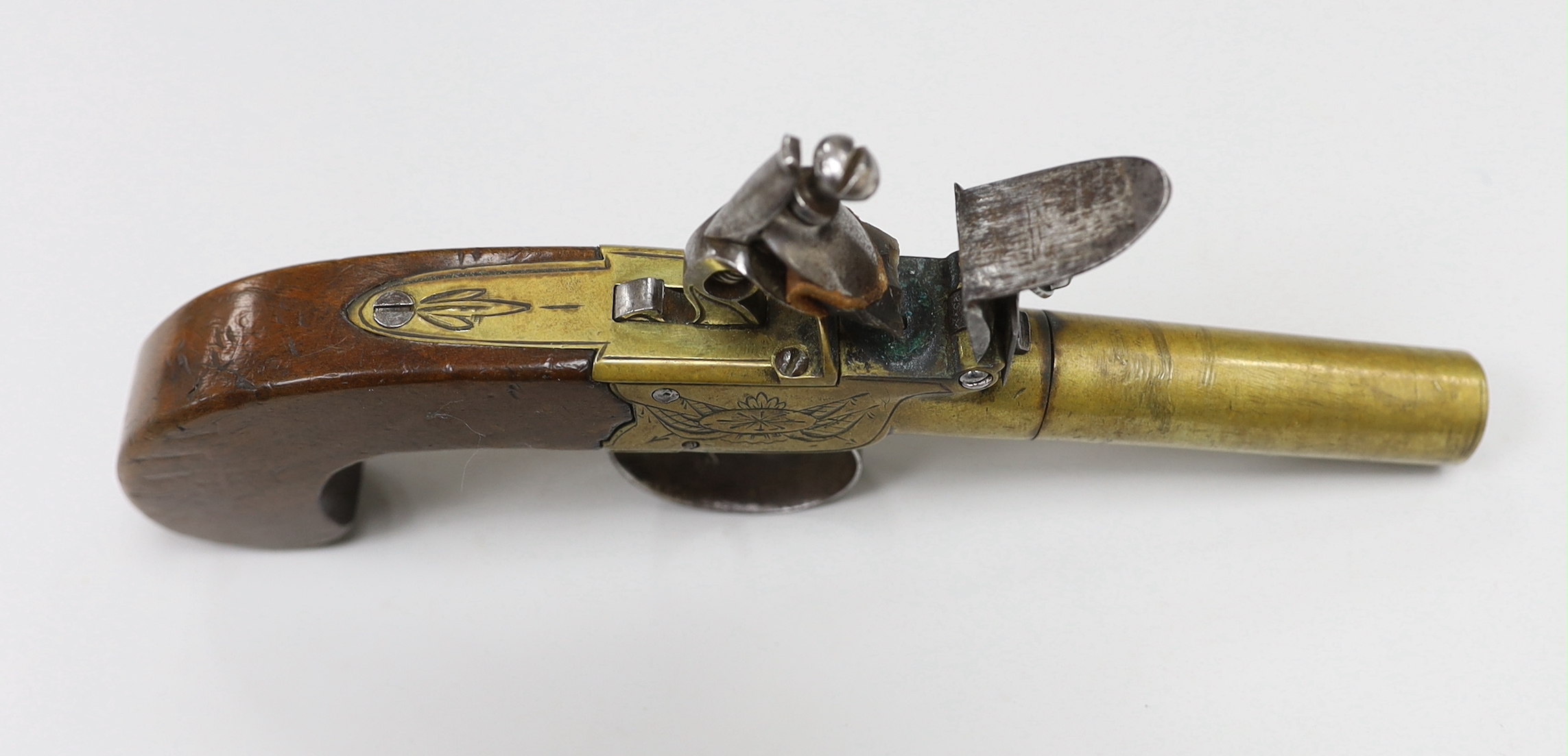 A George III flintlock pocket pistol, with turn off brass barrel, signed ‘Lawrence’
